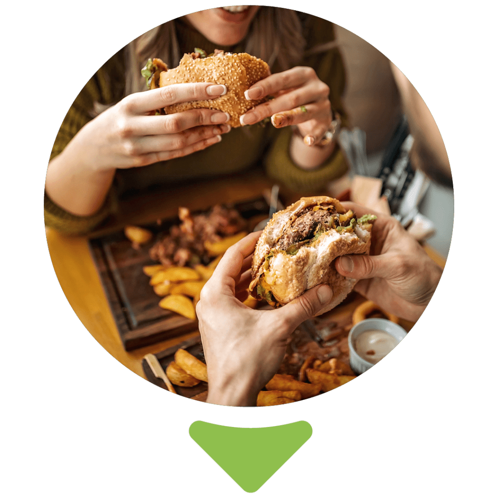 people eating burgers